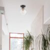Globe Electric Harrow 1-Light Semi-Flush Mount Ceiling Light with a Matte Black Finish, Gold Accent Socket and Clear Glass Shade, Dimmable Option Globe Electric Harrow 1-Light Semi-Flush Mount Ceiling Light with a Matte Black Finish, Gold Accent Socket and Clear Glass Shade, Dimmable Option