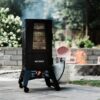 Masterbuilt 40-inch ThermoTemp Propane Gas Vertical BBQ Smoker with Analog Temperature Control and 960 Cooking Square Inches in Black, Model MB20051316