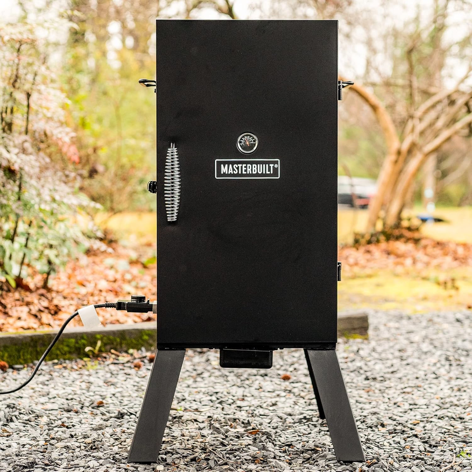 Masterbuilt® 30-inch Electric Vertical BBQ Smoker with Analog Temperature Control, Chrome Smoking Racks and 535 Cooking Square Inches in Black, Model MB200702100 Masterbuilt® 30-inch Electric Vertical BBQ Smoker with Analog Temperature Control, Chrome Smoking Racks and 535 Cooking Square Inches in Black, Model MB20070210